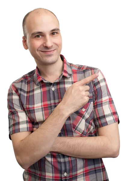 Portrait of a happy young man pointing finger — Stock Photo, Image