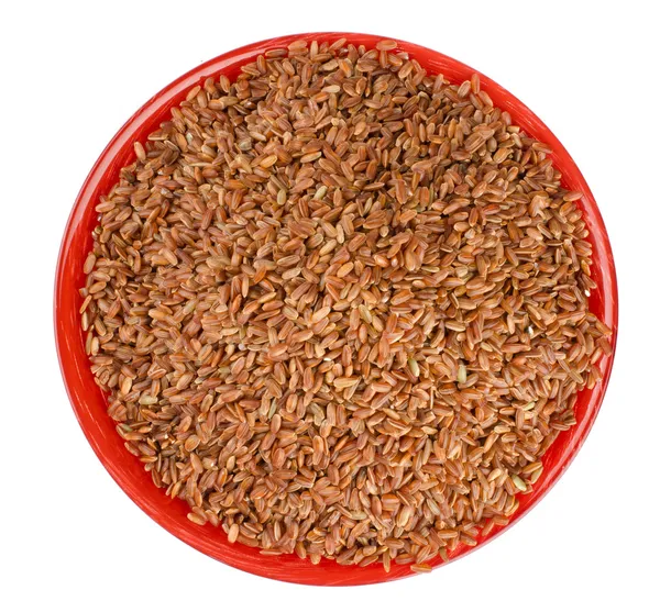 Коричневый рис в миске — стоковое фото