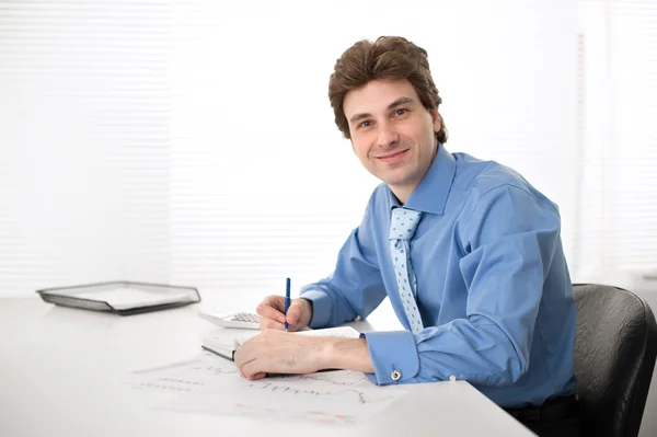 Business man working on computer in the office Royalty Free Stock Images