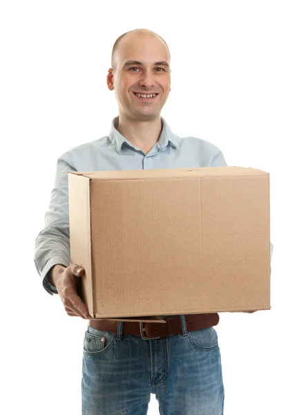 Smiling delivery man holding a big parcel — Stock Photo, Image