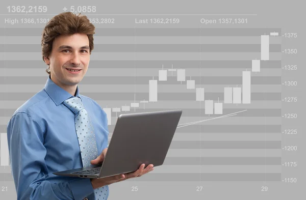 Stock broker at work with his laptop — Stock Photo, Image