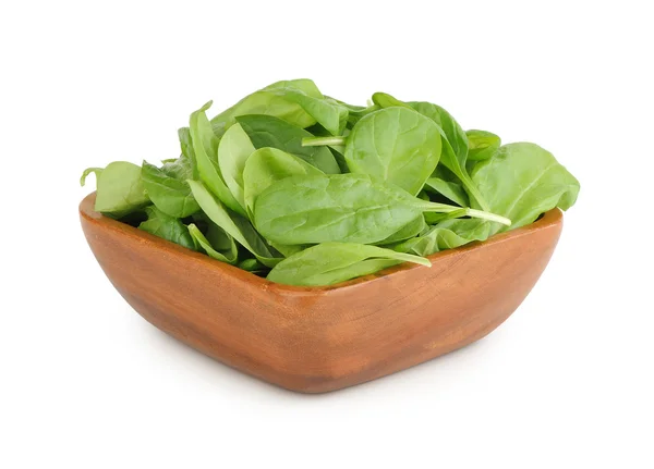 Spinach in a wooden plate — Stock Photo, Image