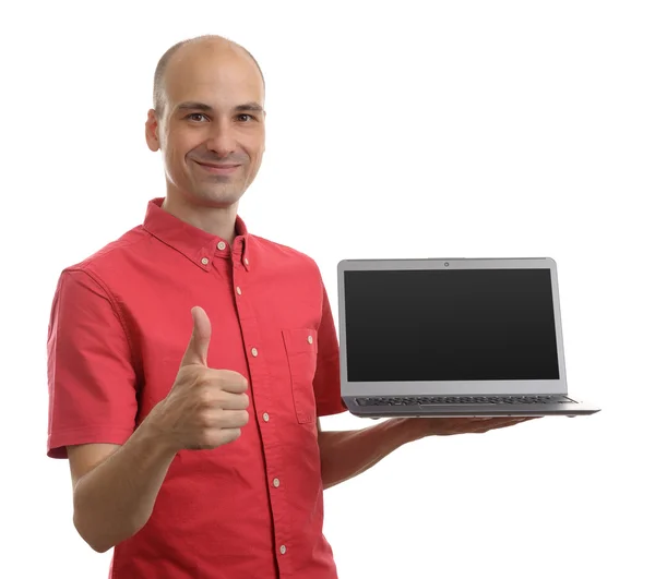 Man holding an open laptop with thumb up isolated on white backg — Stock Photo, Image