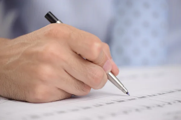 Close-up of business person hand with pen Stock Image