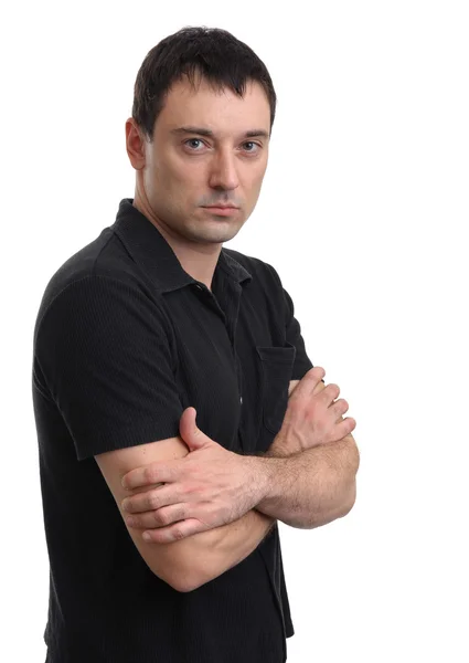 Casual young man looking at camera with arms crossed — Stock Photo, Image