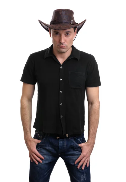 Uomo in un cappello da cowboy isolato su bianco — Foto Stock
