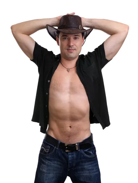 Sexy hombre en un vaquero sombrero aislado en blanco — Foto de Stock