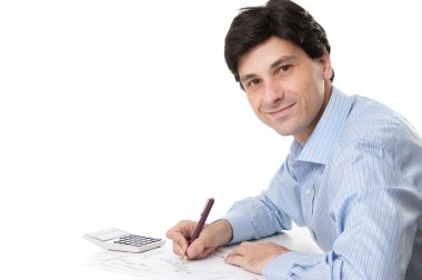 ofis masasında oturan orta yaşlı işadamı