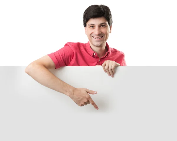 Feliz sorrindo homem detém uma placa em branco — Fotografia de Stock