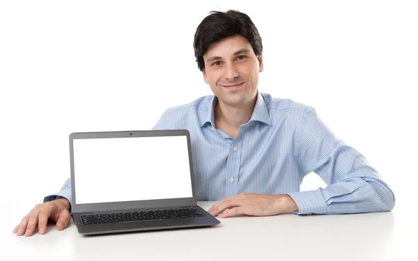 Joven hombre de negocios guapo mostrando el ordenador portátil —  Fotos de Stock