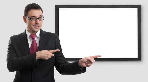 Hombre de negocios señalando en la pantalla en blanco del monitor — Foto de Stock