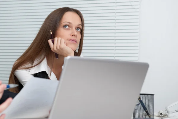 Portrait of businesswoman daydreaming inside the office — Stock Photo, Image