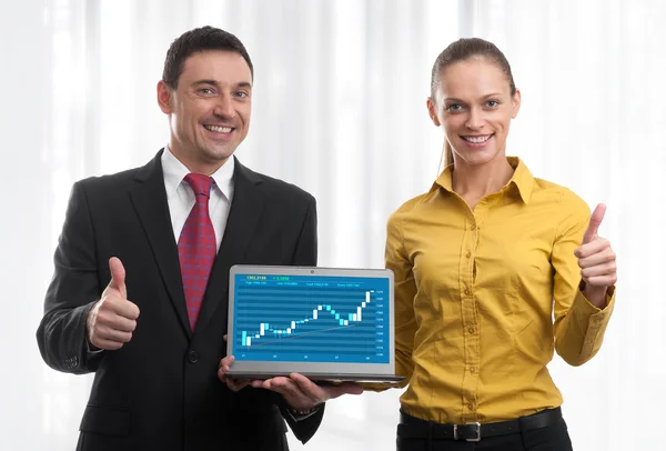 Man and woman with laptop — Stock Photo, Image