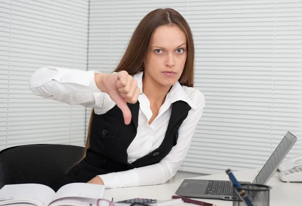 Young business woman showing dislike sign Stock Image