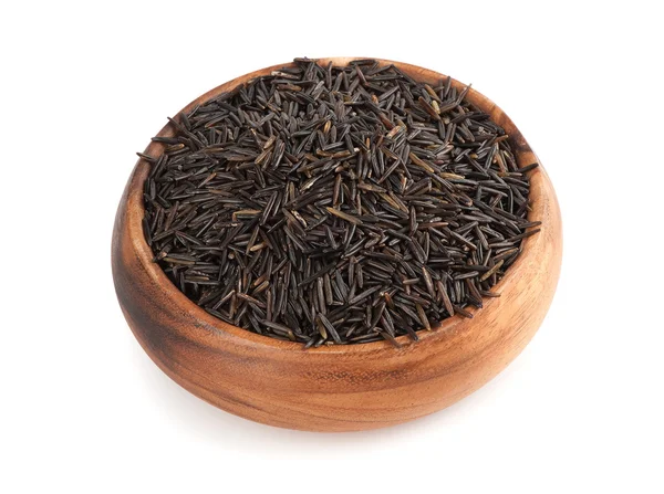 Raw wild rice in wooden bowl — Stock Photo, Image
