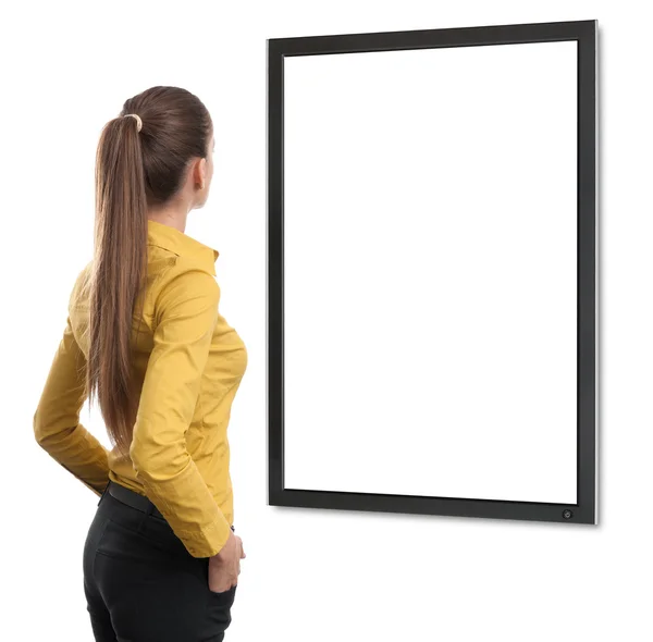 Business woman from the back looking at tv — Stock Photo, Image