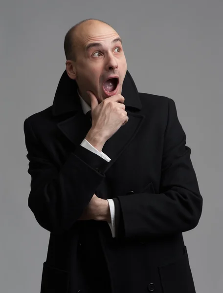 Shocked man wearing overcoat — Stock Photo, Image