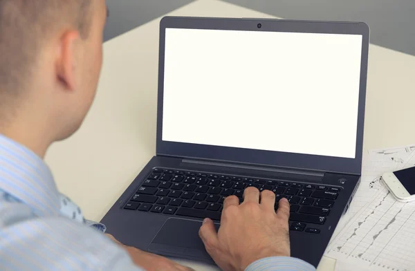 Rear view of a business man working on his laptop computer — Stock Photo, Image