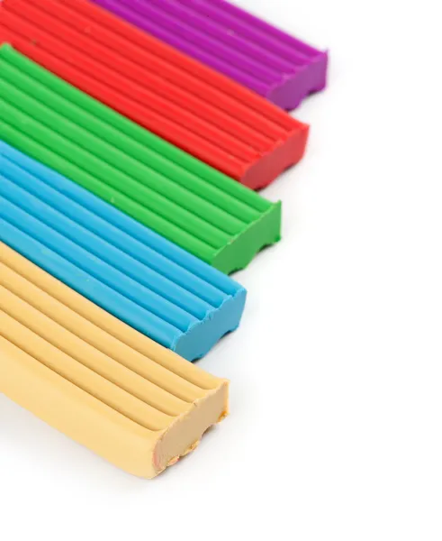 Pieces of colored plasticine on a white background — Stock Photo, Image