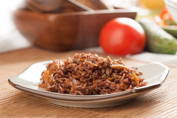 Red rice with onion and carrot — Stock Photo, Image