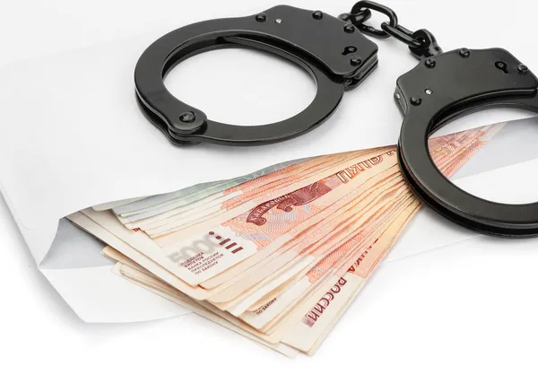 Handcuffs on Russian money — Stock Photo, Image