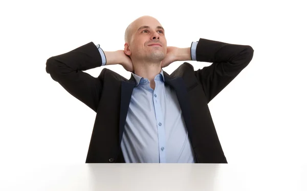 Uomo d'affari rilassante con le mani dietro la testa — Foto Stock