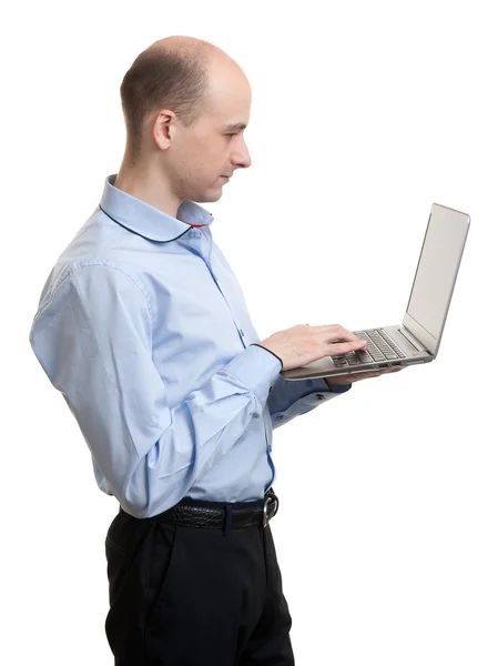Portrait of young businessman with laptop Stock Image