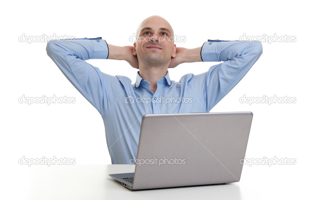 relaxing bald man with laptop computer