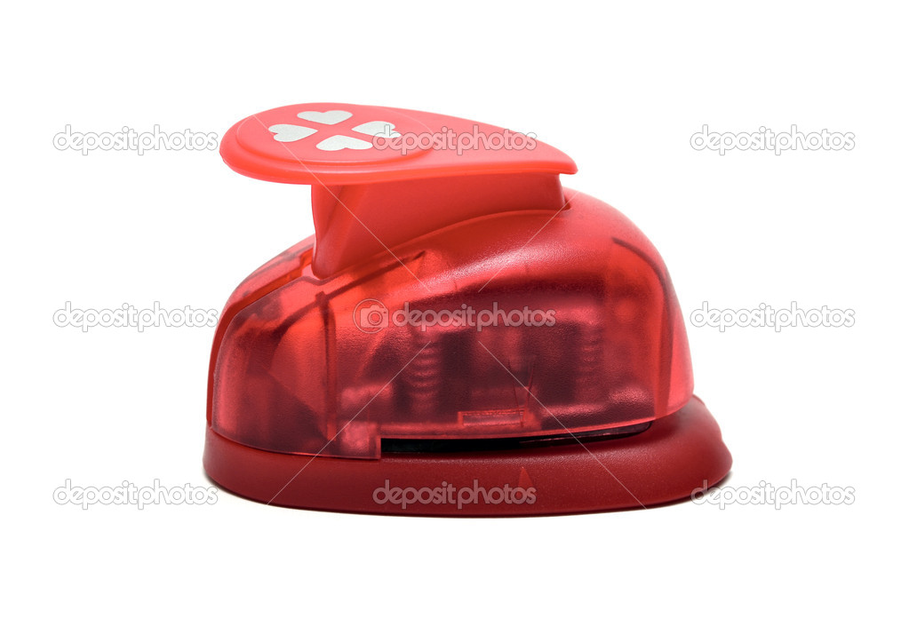 Red paper puncher on a white isolated background