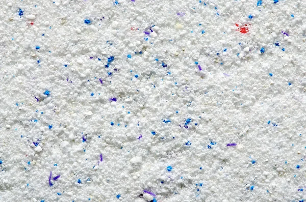 Washing powder texture with blue and red disseminations — Stock Photo, Image