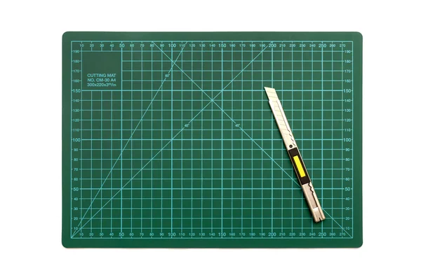 Green cutting mat on a white background — Stock Photo, Image