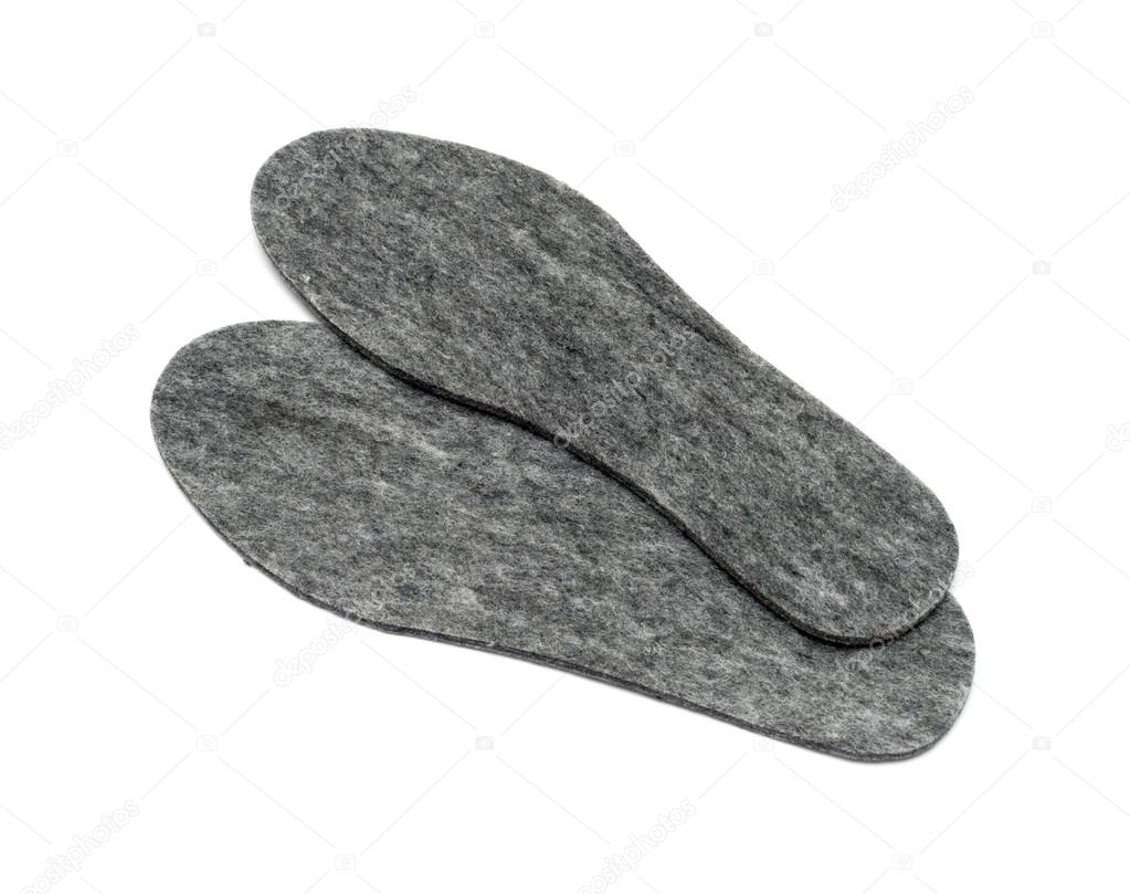 Felt insoles for shoes isolated on white background
