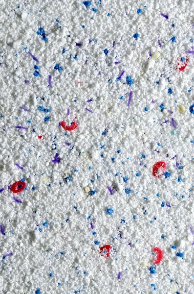 Washing powder texture with blue and red disseminations — Stock Photo, Image
