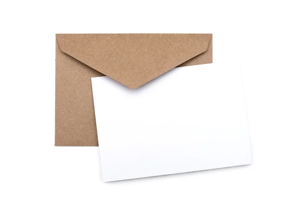Brown envelope with a blank white card over white — Stock Photo, Image