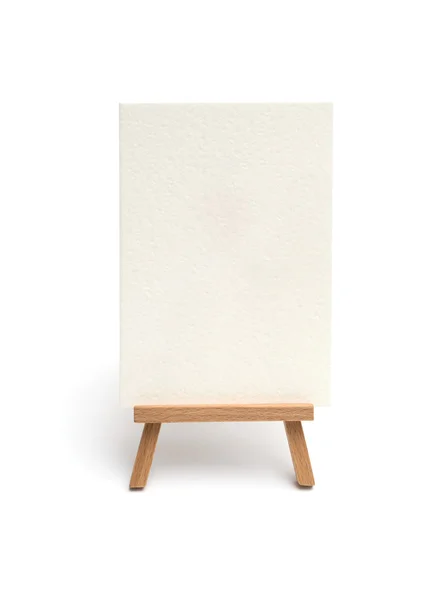 Small easel with sheet of paper isolated on white — Stock Photo, Image