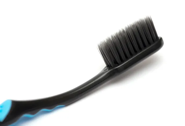 New toothbrush close-up on white background — Stock Photo, Image