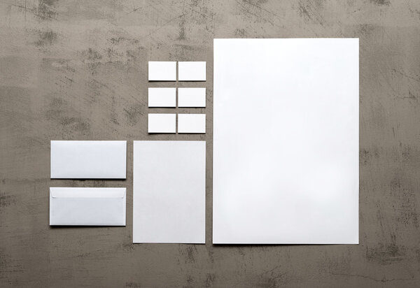 set of corporate identity templates on a gray wall