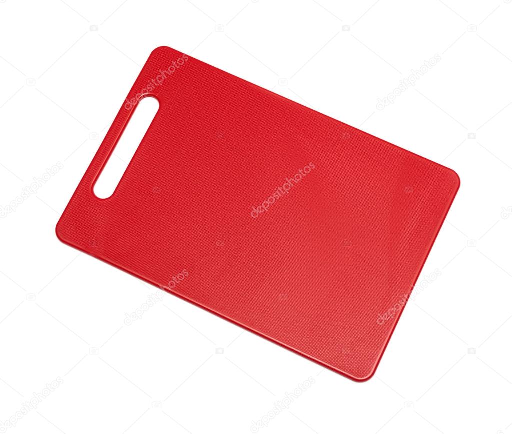 Red plastic cutting board isolated on white