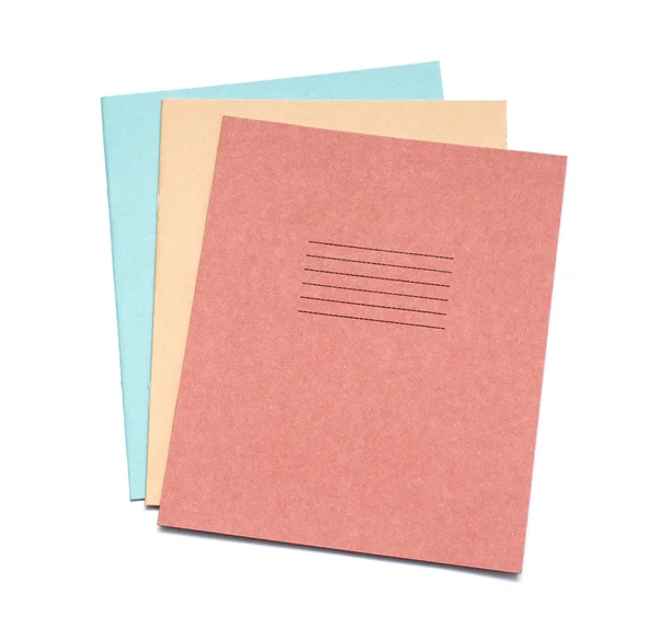 Multicolored exercise books over the white background — Stock Photo, Image