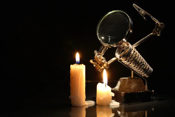 Magnifying Glass And Candles — Stock Photo, Image