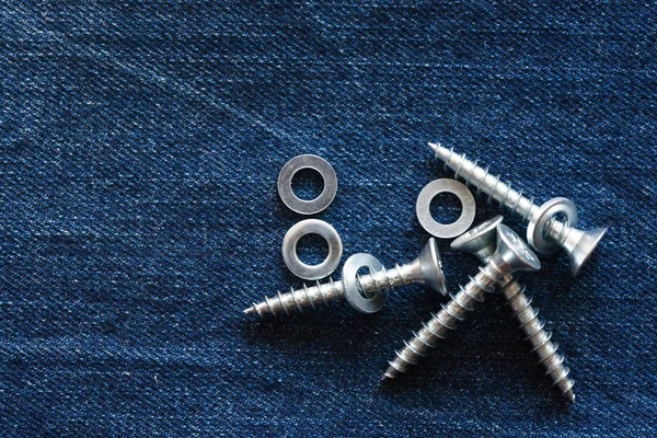 Screws On Denim — Stock Photo, Image