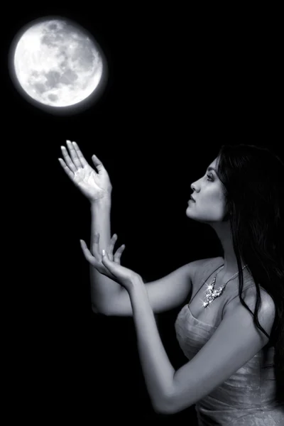 Fairy girl pulls hands to the moon — Stock Photo, Image