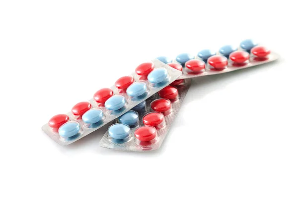 Συσκευασία Των Χαπιών Μπλε Και Κόκκινο Χάπια Λευκό Φόντο — Φωτογραφία Αρχείου