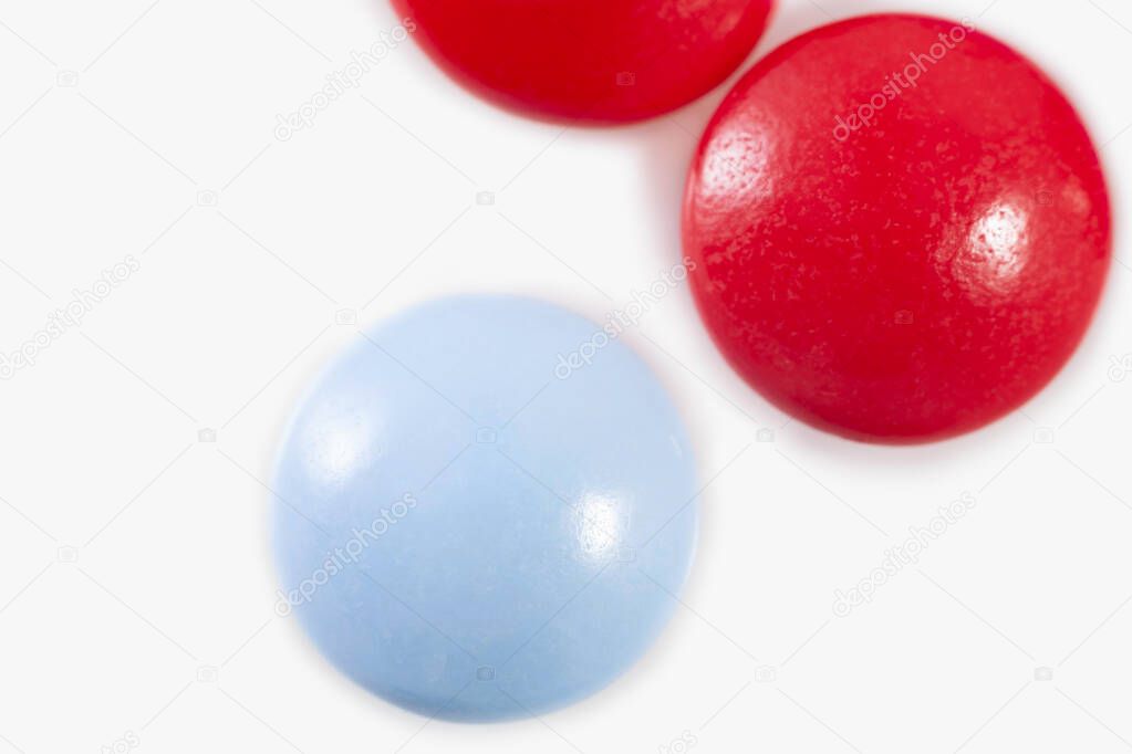 blue and red pills on white background