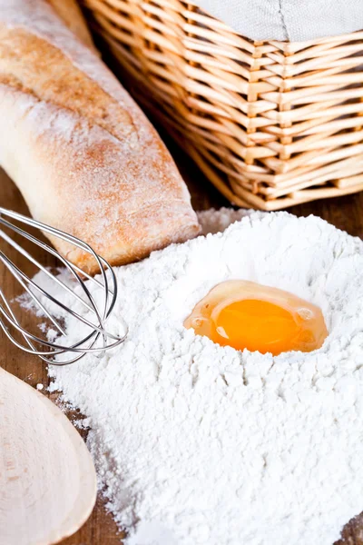 Bread, flour, eggs and kitchen utensil — Stock Photo, Image