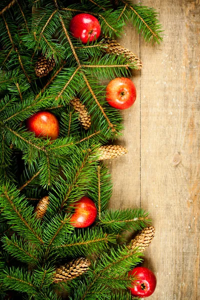 Christmas fir tree with pinecones and apples — Stock Photo, Image