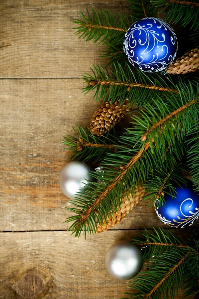 Christmas fir tree with pinecones and decorations — Stock Photo, Image