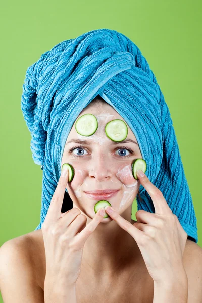 Woman in blue towel and mask from cucumber — Stock Photo, Image