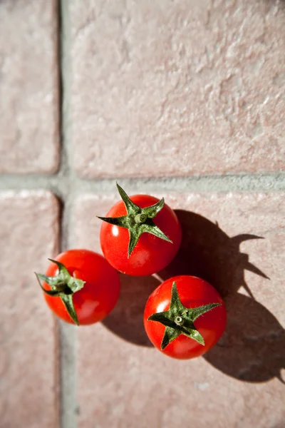 Three cherry tomatoes — Stock Photo, Image