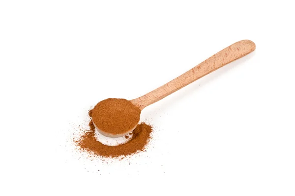 Ground cinnamon in wooden spoon — Stock Photo, Image